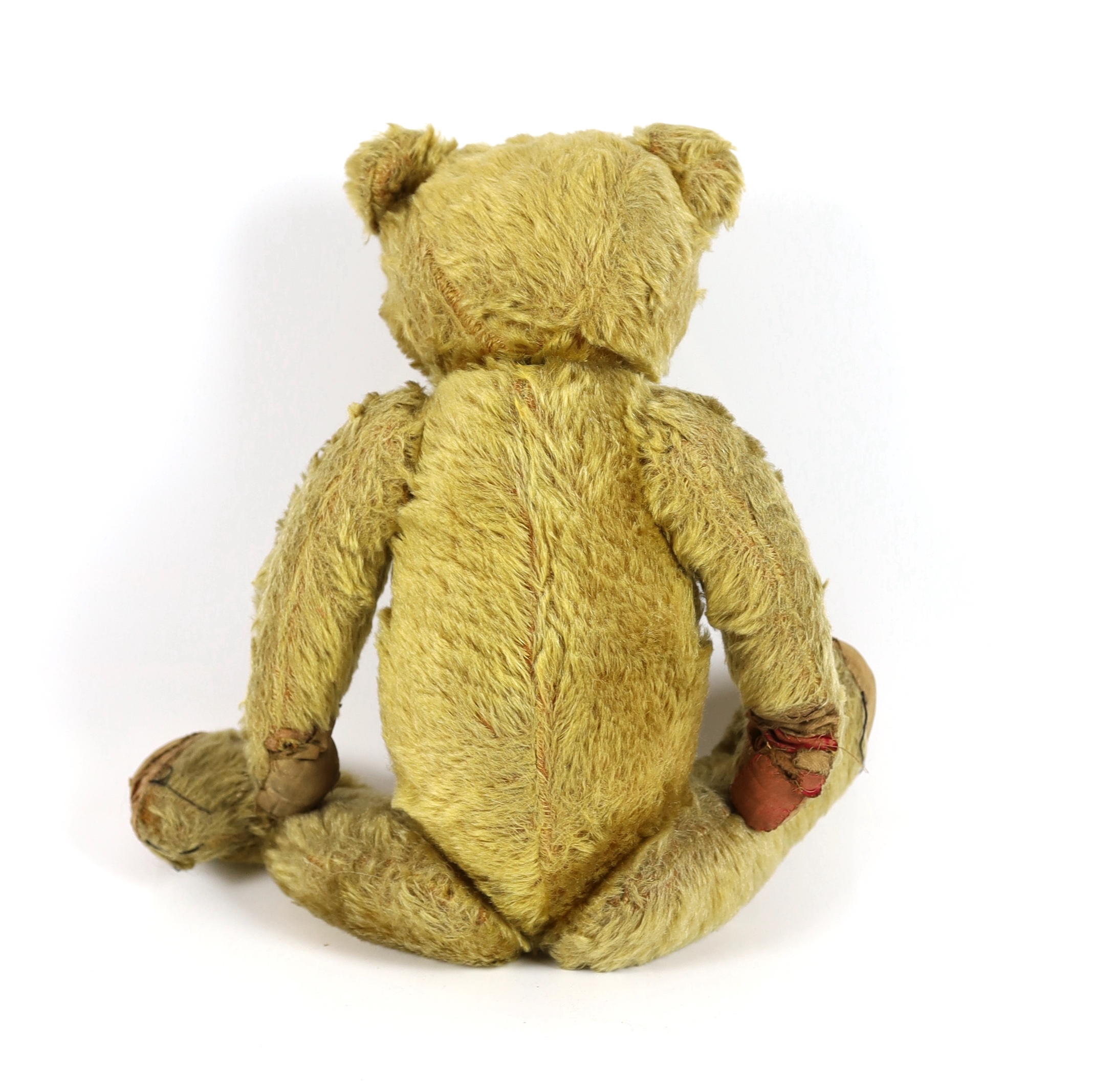 An early German bear, c.1912, black button eyes, 45cm, old repair to paws, good mohair